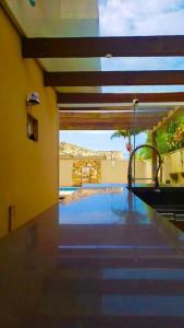 a view of a swimming pool in a house at Praia Xangri-lá Atlântida Capão da Canoa Torres in Xangri-lá