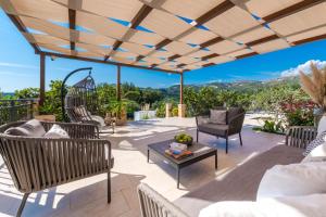 a patio with chairs and a table at Villa Paulina in Mlini