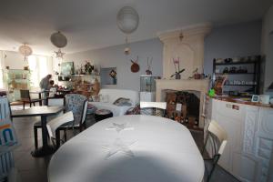a dining room with a table with two stars on it at La Belle Etoile in Saintes