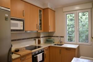 A kitchen or kitchenette at Piso centro Santander - Parking Gratuito
