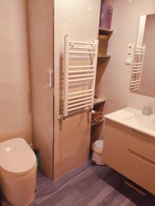 a bathroom with a toilet and a sink at Persistencia de la Memoria in Cogolludo +42 photos