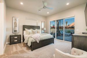 a bedroom with a bed and a balcony at 30-31| 2 Homes in St George with Private Pools and Hot Tubs in Santa Clara +96 photos