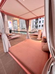a large bed in a room with a view at Ocean View Entire Condo In Downtown With Pool and Gym in Miami
