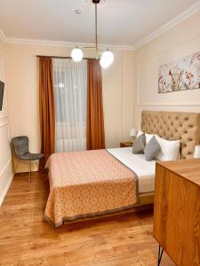 Postel nebo postele na pokoji v ubytování Hotel Wine Time Tbilisi