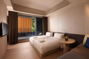 Letto o letti in una camera di 礁溪晶泉丰旅 Wellspring by Silks Jiaoxi