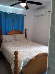 Postel nebo postele na pokoji v ubytování Crisfer Punta Cana
