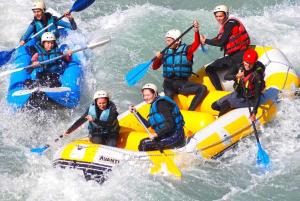 a group of people on a raft in the water at Chalet le Panorama des Alpes à Guillestre in Guillestre