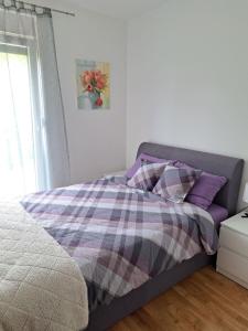 Postel nebo postele na pokoji v ubytování Apartman ANA