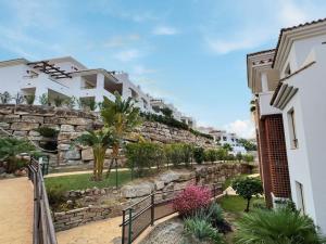 a stone retaining wall next to a building at Gorgeous 3-Bedroom Penthouse with Expansive Terrace in Casares Costa in Buenas Noches