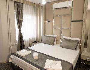 a hotel room with a bed and a window at Grand Heykel Hotel in Bursa +90 photos