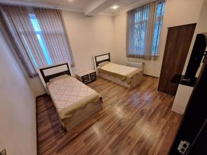 Postel nebo postele na pokoji v ubytování Arena Hotel Khachmaz