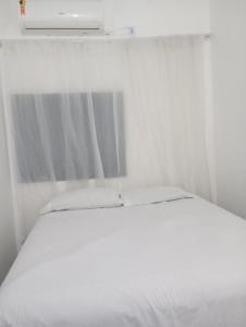 Postel nebo postele na pokoji v ubytování Suíte Casa Central Garagem Hatch