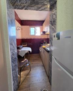 Kuchyň nebo kuchyňský kout v ubytování Oasis