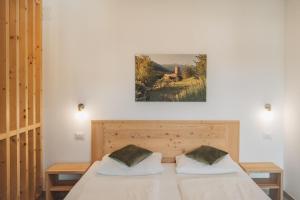 Postel nebo postele na pokoji v ubytování Residence Karpoforus