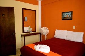 Postel nebo postele na pokoji v ubytování Hotel Casa Rus