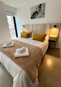 Postel nebo postele na pokoji v ubytování Depto 2 amb PLAYA GRANDE con Cochera - C -