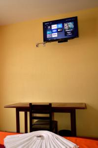 TV a/nebo společenská místnost v ubytování Hotel Casa Rus