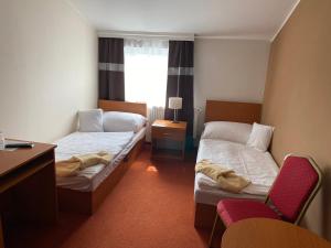 Katil atau katil-katil dalam bilik di Hotel Černý Orel Žatec