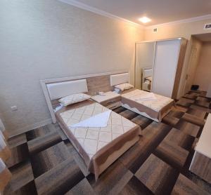 Postel nebo postele na pokoji v ubytování Arena Hotel Khachmaz