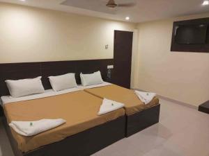 Postel nebo postele na pokoji v ubytování Travel INN Bukitbintang