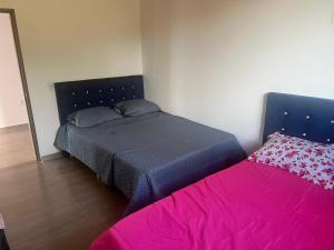 Postel nebo postele na pokoji v ubytování Quinta Las Mendoza