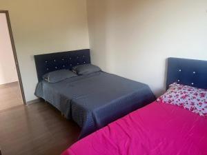 Postel nebo postele na pokoji v ubytování Quinta Las Mendoza