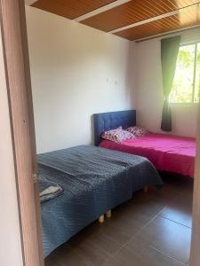 Postel nebo postele na pokoji v ubytování Quinta Las Mendoza