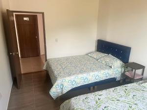 Postel nebo postele na pokoji v ubytování Quinta Las Mendoza