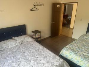 Postel nebo postele na pokoji v ubytování Quinta Las Mendoza