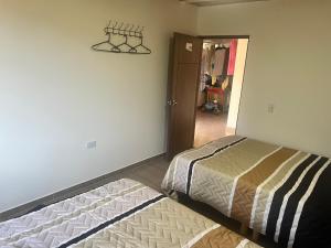 Postel nebo postele na pokoji v ubytování Quinta Las Mendoza