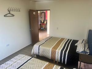 Postel nebo postele na pokoji v ubytování Quinta Las Mendoza