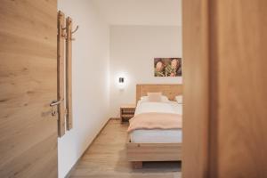 Postel nebo postele na pokoji v ubytování Residence Karpoforus