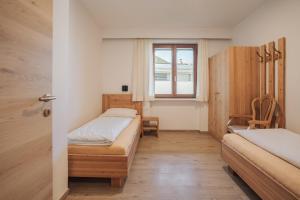 Postel nebo postele na pokoji v ubytování Residence Karpoforus