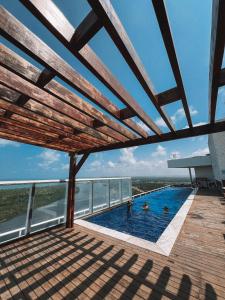 a swimming pool on the roof of a building at Silverton Paiva Experience in Recife