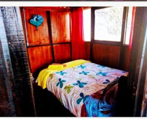a bedroom with a bed in a room with a window at Madervillhospedaje in Aquitania +12 photos