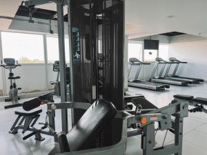 a gym with several treadmills and tread machines at Silverton Paiva Experience in Recife