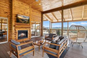 a living room with a fireplace and chairs at Private Pool Hot Tub Air Hockey Mountain Views Large Patio - Brynwood Station in Waldens Creek