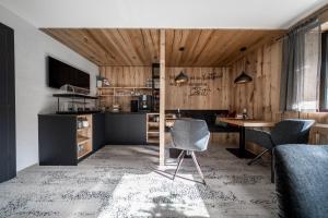 a kitchen with a table and chairs in a room at Bianca`s BB in Sölden