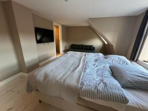 Postel nebo postele na pokoji v ubytování Byhuset - Penthouse
