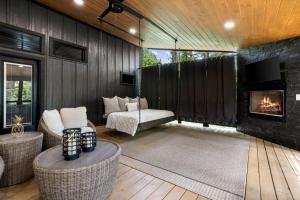 a living room with a couch and a fireplace at Enchanting Escape for Two in Broken Bow
