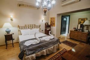 Кровать или кровати в номере Villas D'Egypte +10 фотографий