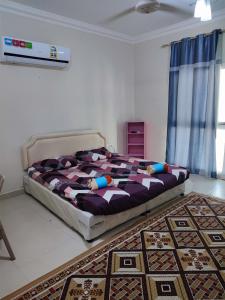 A bed or beds in a room at Amiran