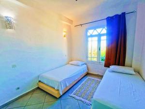 Кровать или кровати в номере P1 duplex vue sur Mer