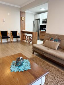 O zonă de relaxare la Apartamento acolhedor ideal para um casal