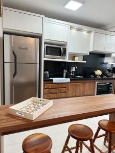 O bucătărie sau chicinetă la Apartamento acolhedor ideal para um casal