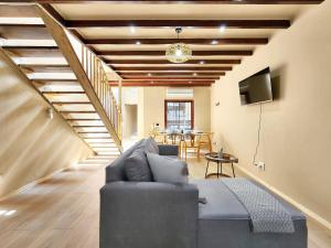 a living room with a couch and a table at Newly renovated, City Central, Spacious and Family friendly in Cape Town