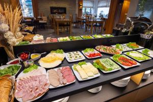 a buffet line with many different types of food at Willa Pod Kozińcem in Czarna Góra