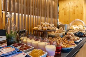 a buffet of pastries and drinks on a table at Willa Pod Kozińcem in Czarna Góra +163 photos