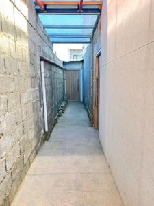 an empty hallway in a building with a brick wall at Descanso Río Grande in Río Grande