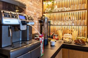a kitchen with a coffee machine on a counter at Willa Pod Kozińcem in Czarna Góra